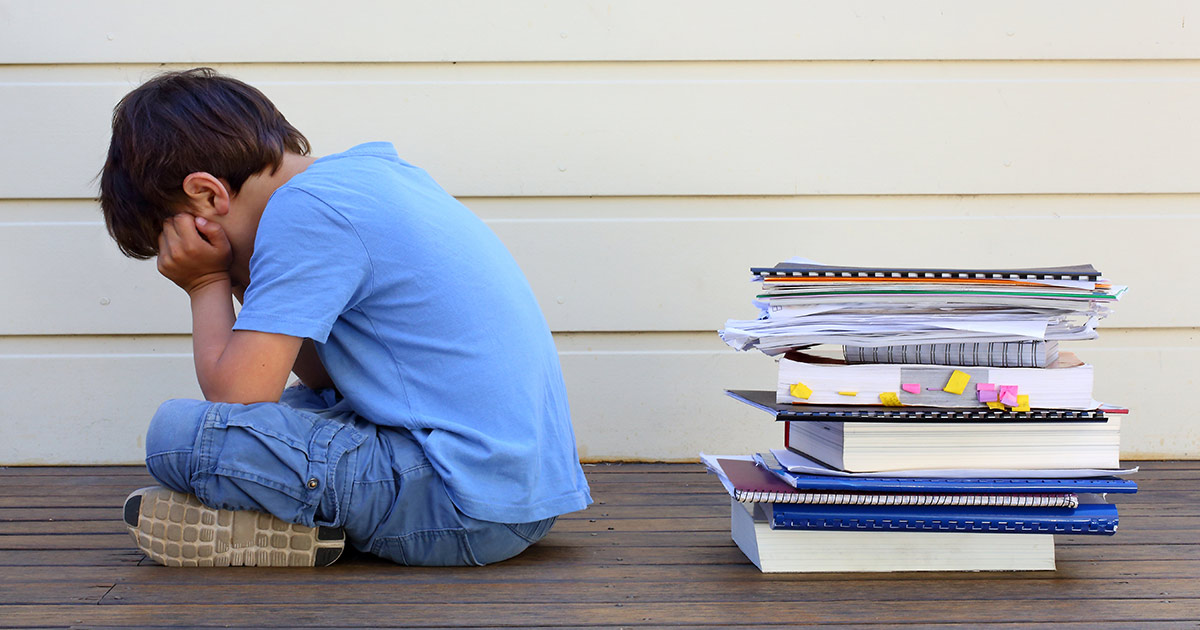 A child turning his back on books