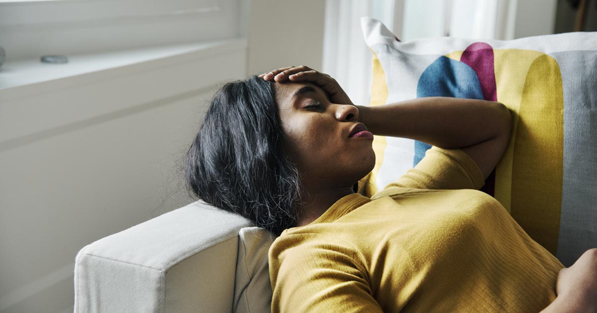 A burnt-out teacher resting on a couch