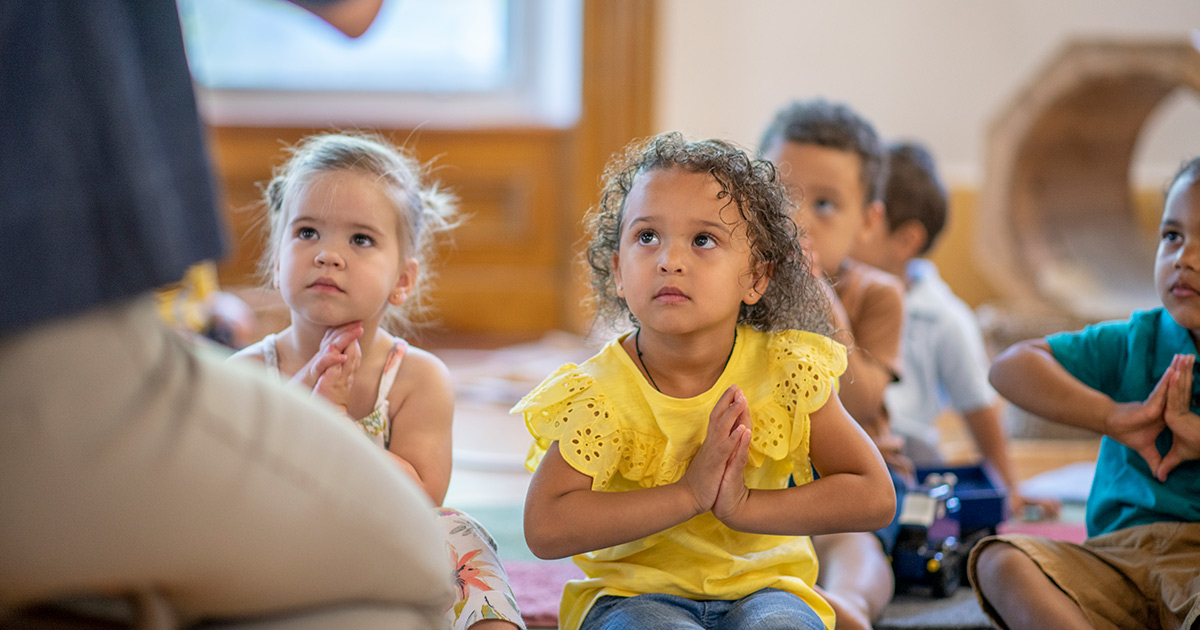 A teacher leading students in a mindfulness training