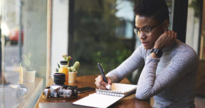 A teacher writing down her professional goals