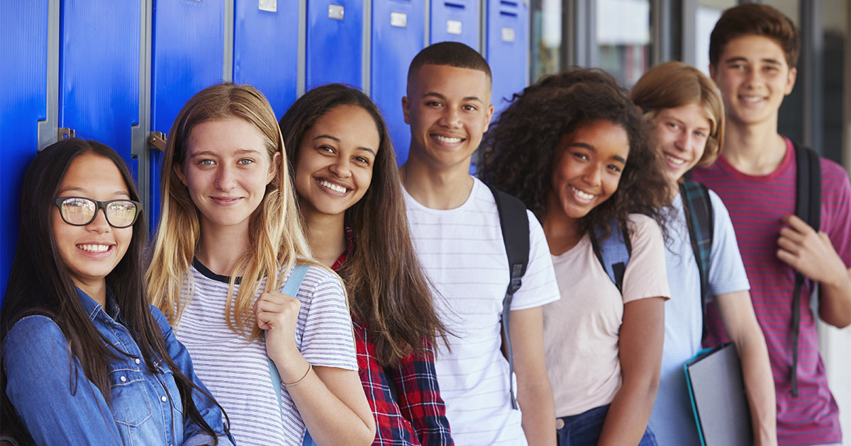 High school kids lined up along lockers