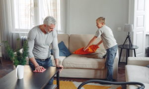 Man and boy cleaning