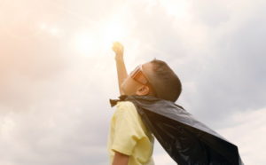 Boy pretending to be superhero