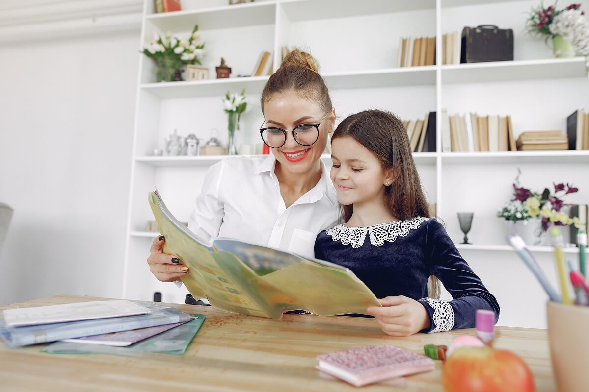 Woman reading to a girl