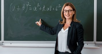 Teacher looking at chalkboard