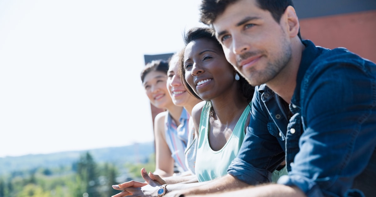Group of adults smiling outside