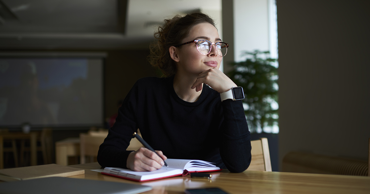 A teacher working on her mid-year checklist