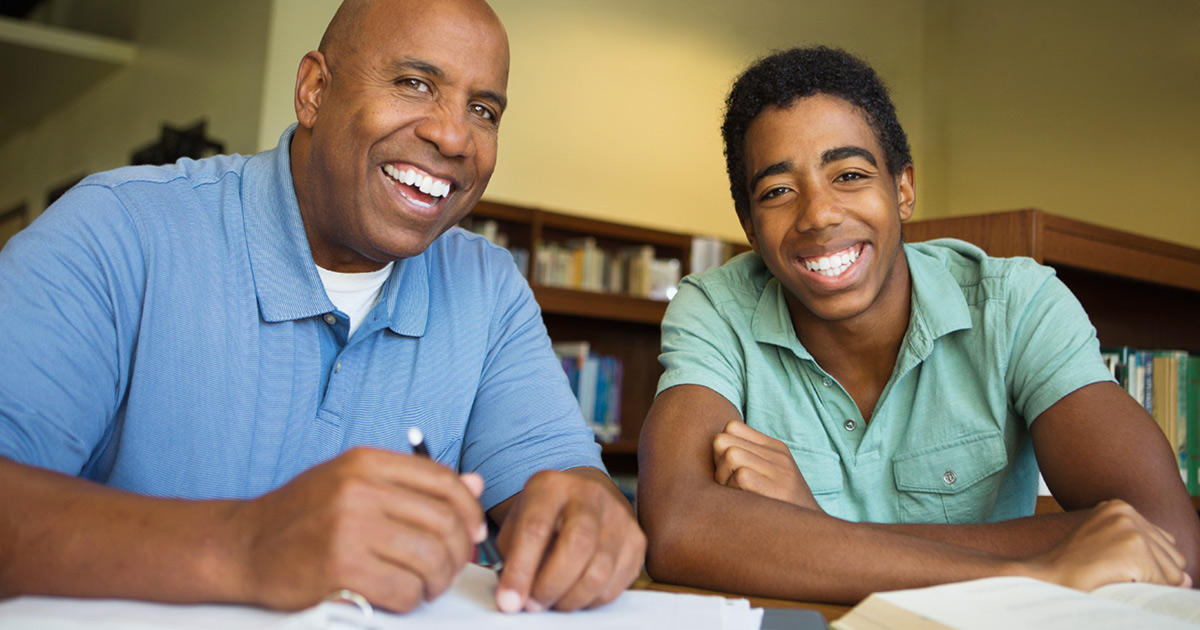 A teacher and a student working positively together