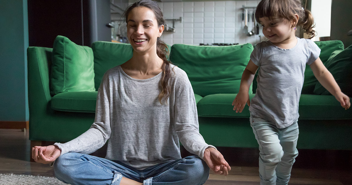 Lady meditating with kid