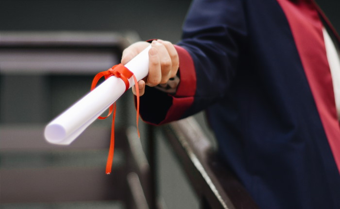 Person holding diploma
