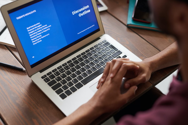 Person sitting in front of laptop