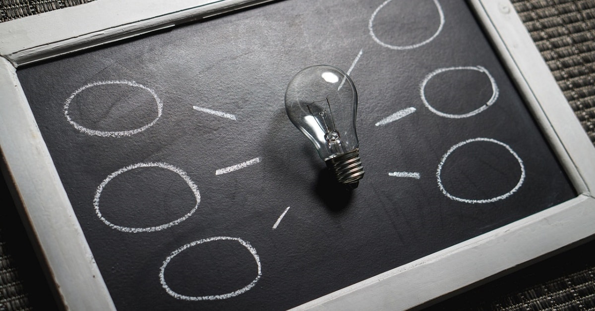 lightbulb and chalk on virtual tablet chalkboard