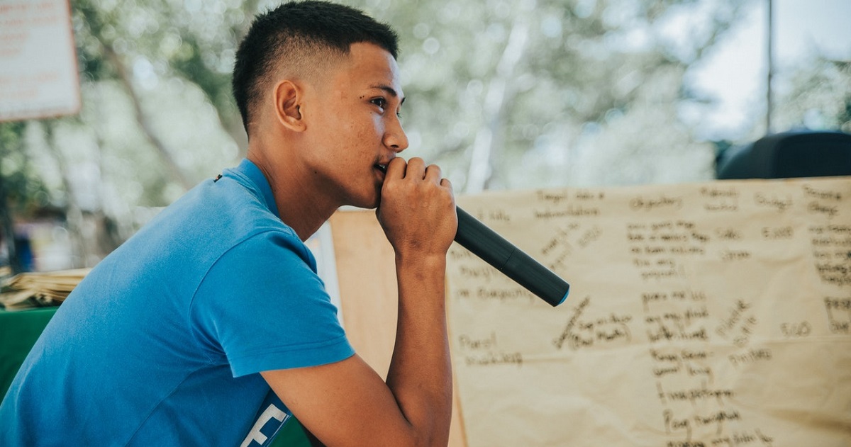 Kid speaking into mic